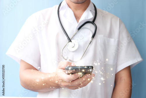 Doctor using mobile smartphone, Medicine doctor with stethoscope. Space for text