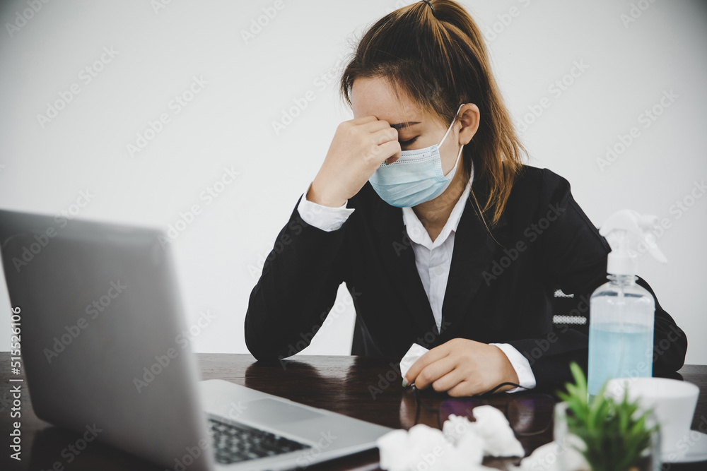 Sick young asian business woman wearing protective face mask Sick young asian business woman wearing protective face mask