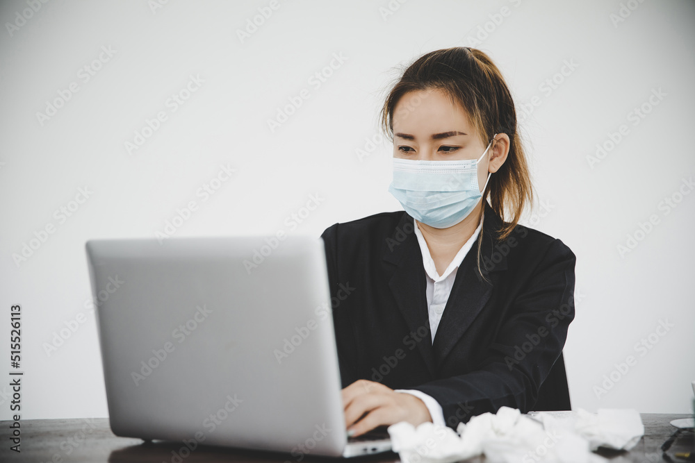 Sick young asian business woman wearing protective face mask Sick young asian business woman wearing protective face mask