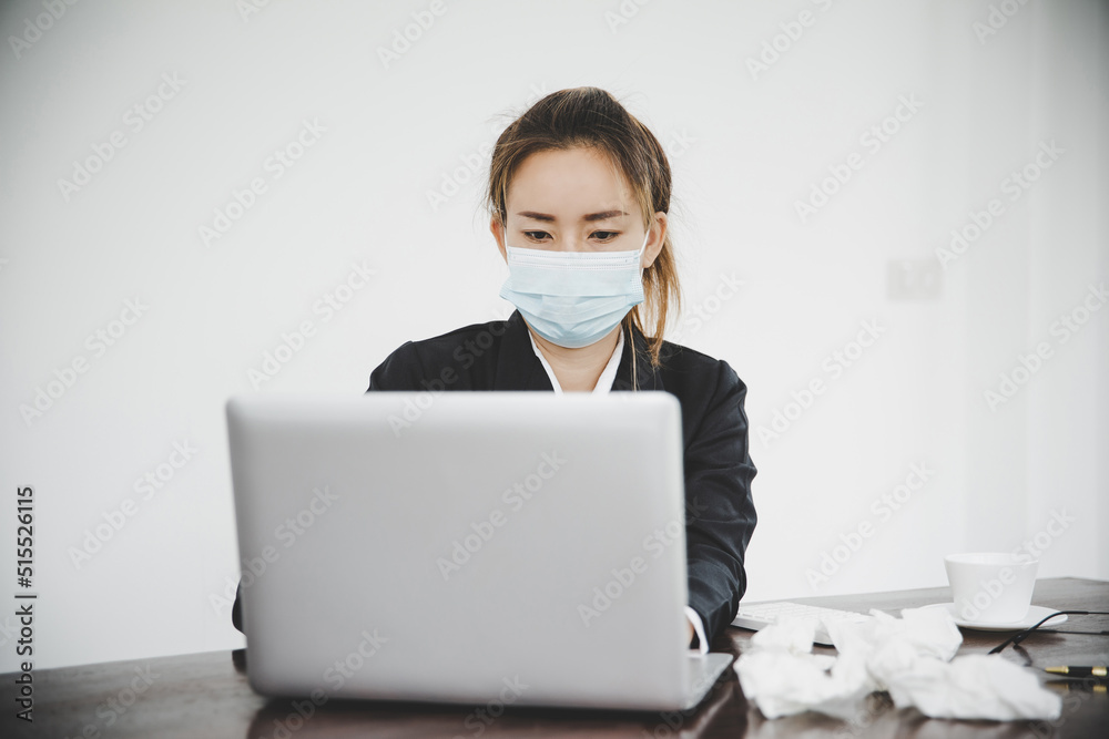 Sick young asian business woman wearing protective face mask Sick young asian business woman wearing protective face mask