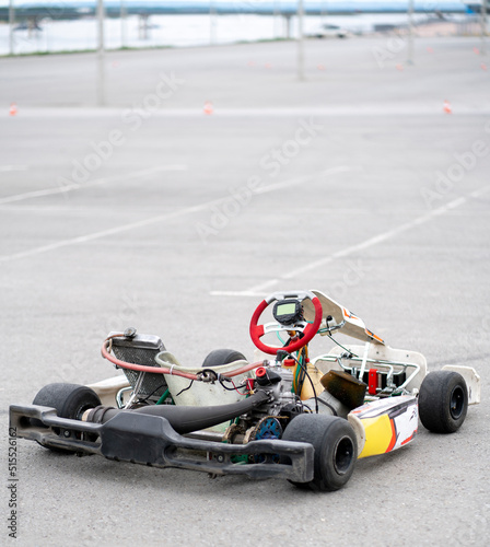 karting machine vehicle parked near racetrack, go-kart hobby