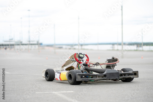 karting machine vehicle parked near racetrack, go-kart hobby © Mihail