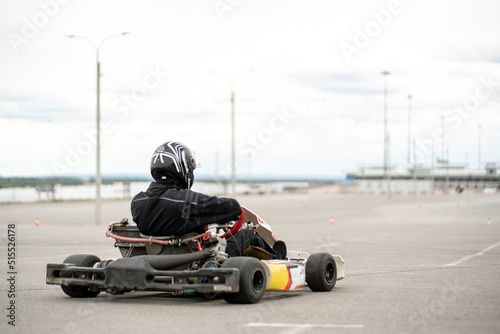 racer pilot driving a karting car machine, auto competition
