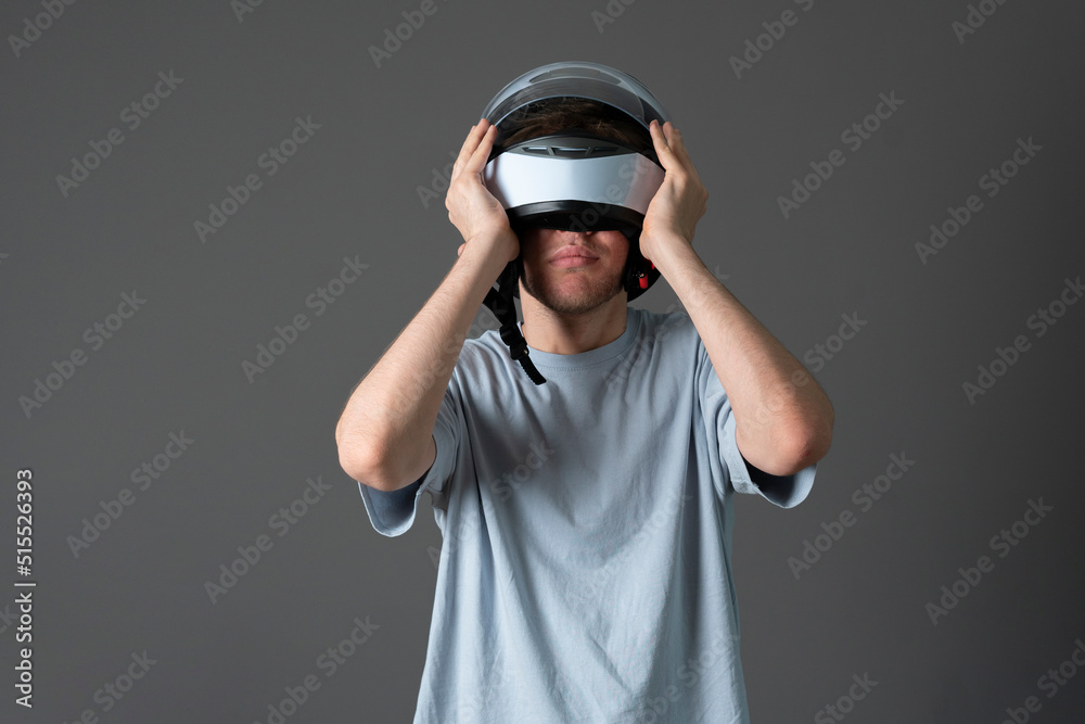 young pilot driver put on white protective racing helmet young pilot driver put on white protective racing helmet