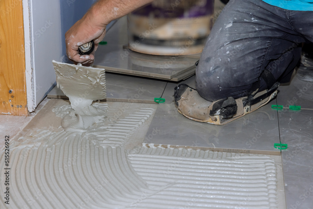 Before adding tiles to a bathroom floor, it is necessary to spread wet mortar with renovation works