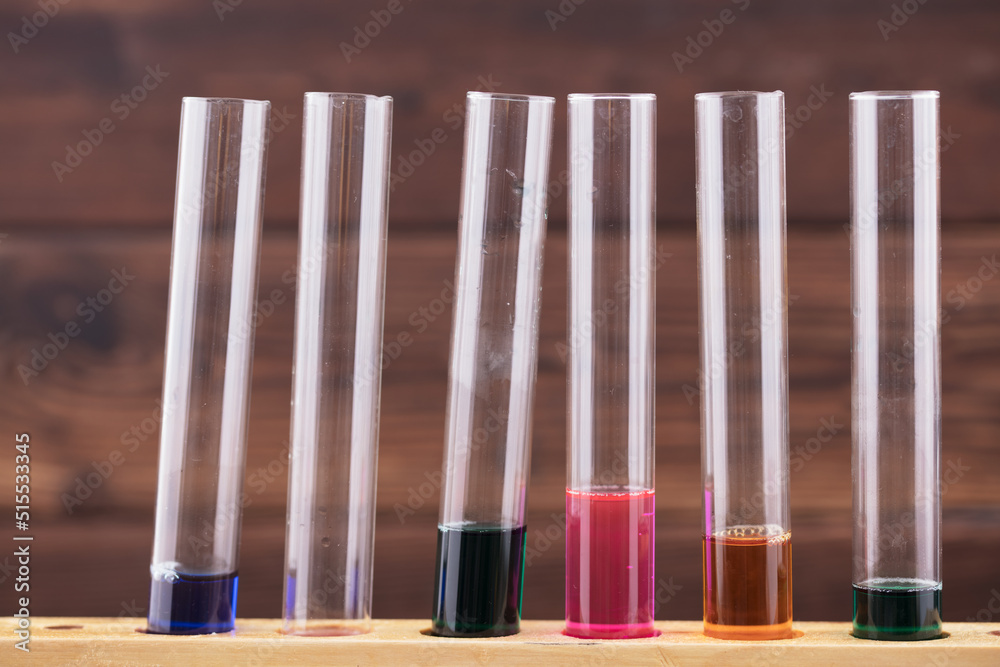 Liquids of different colors are in the test tube Liquids of different colors are in the test tube