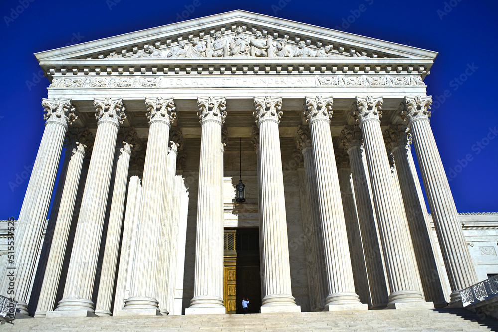 supreme court building in Washington, DC, USA on blue sky