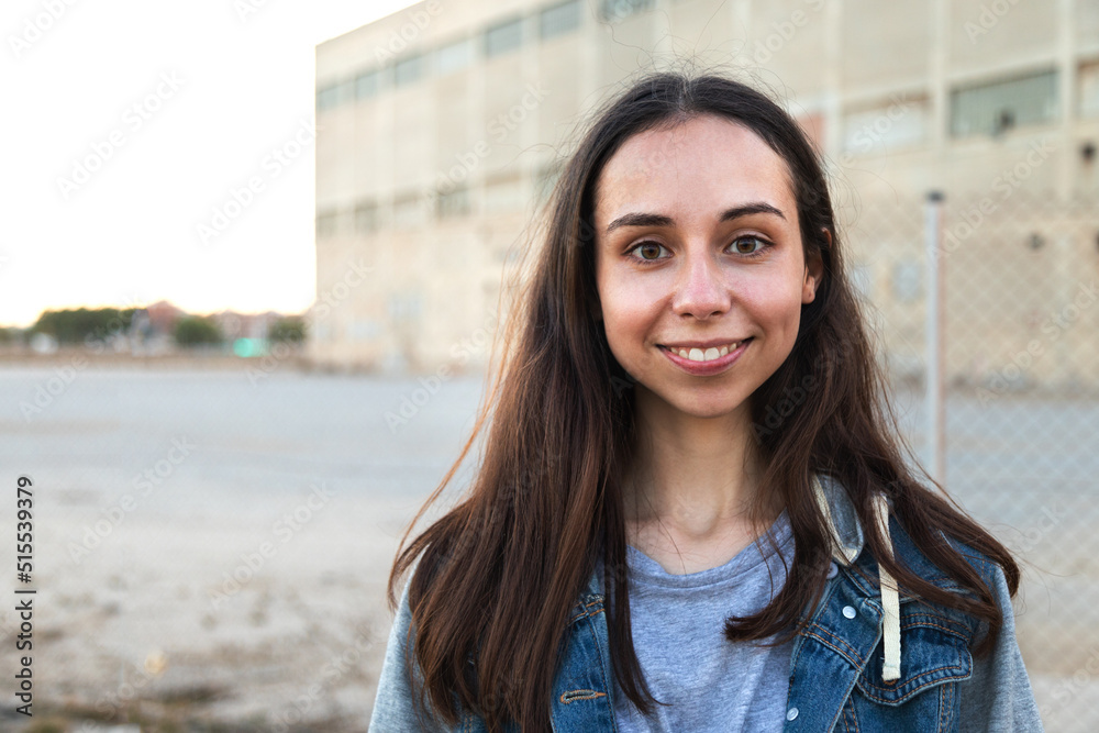 Portrait of happy caucasian girl with long hair looking at camera. Copy space. Portrait of happy caucasian girl with long hair looking at camera. Copy space.