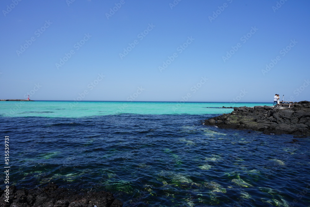 clear bluish water and people