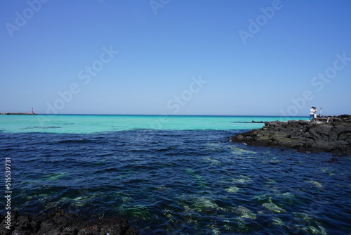 clear bluish water and people