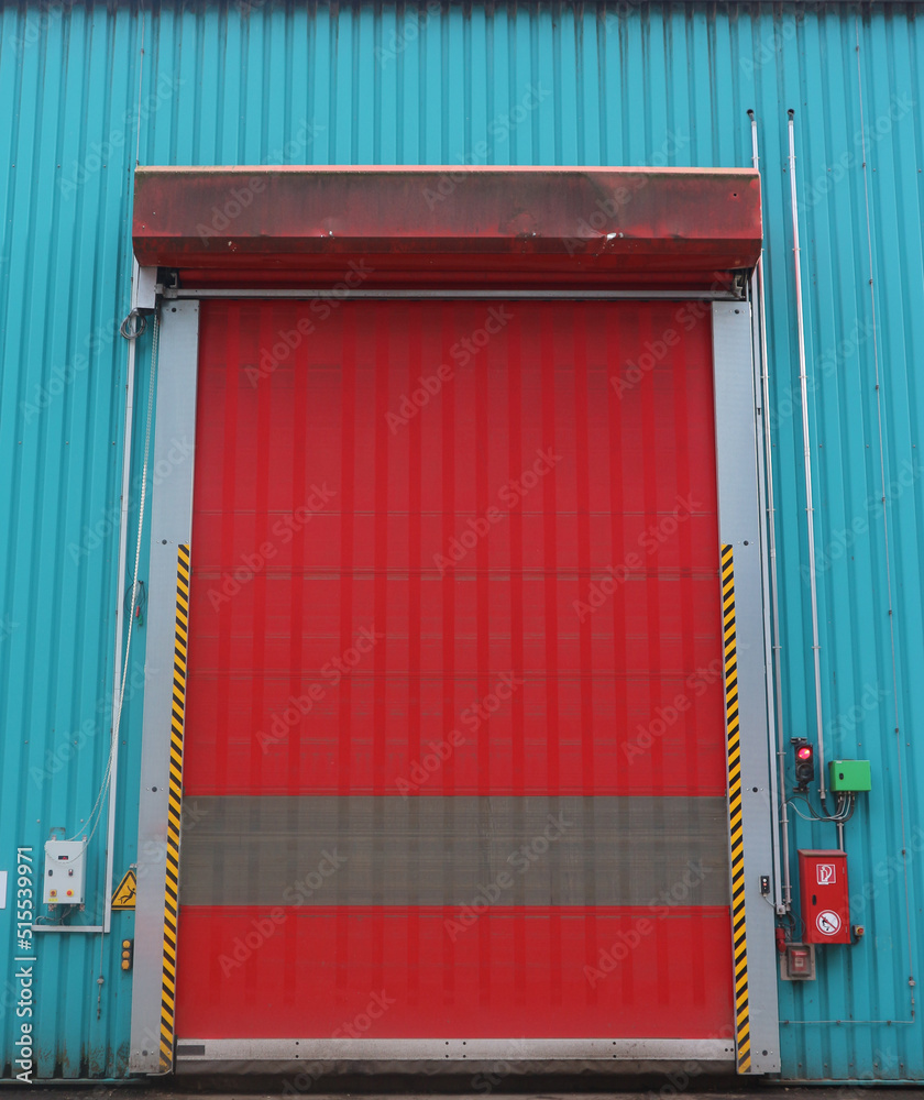 Fast closing industrial rolling door in a waste treatment facility