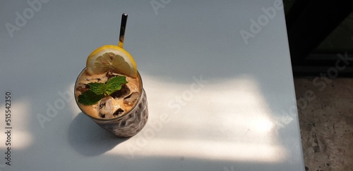 Coffee mixed with cola and lemon