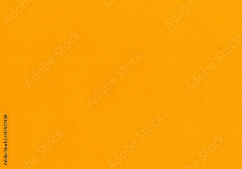 Highly detailed bright, neon orange uncoated paper texture background scan with fine grain fiber particles with copyspace for text for mockup or high resolution wallpapers
