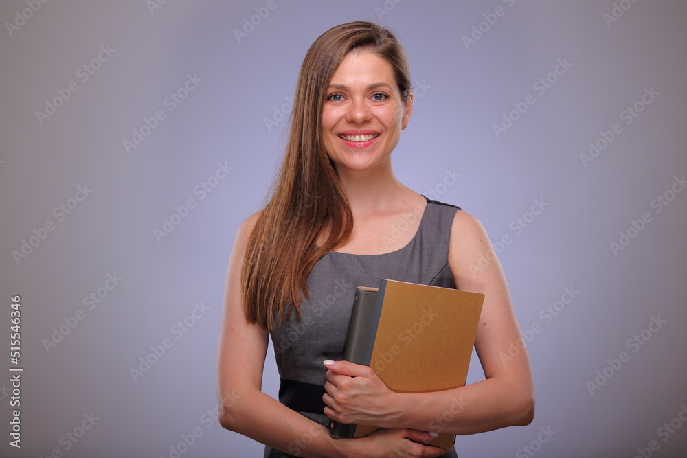 Woman teacher or adult student holding book or workbook, smiling business person, Isolated female portrait. Woman teacher or adult student holding book or workbook, smiling business person, Isolated female portrait.