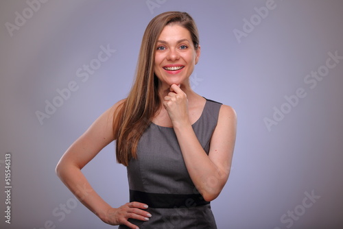 Smiling business woman touching chin, teacher or adult student isolated female portrait. © Yuriy Shevtsov