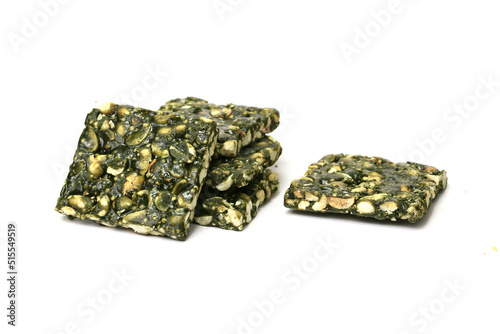 Immunity Booster Spirulina Chikki with groundnut and Jaggery isolated on white background