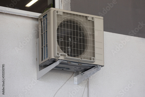 old air conditioning refrigeration unit outside the building