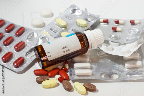 expired drugs with small bottle in the foreground