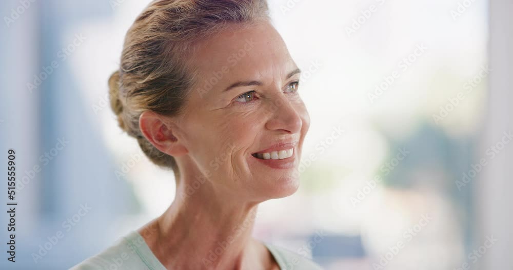 Happy mature woman looking thoughtful and smiling while standing inside with copyspace. Face of pensive lady looking away and planning her future, thinking of an idea or happy past memories Happy mature woman looking thoughtful and smiling while standing inside with copyspace. Face of pensive lady looking away and planning her future, thinking of an idea or happy past memories