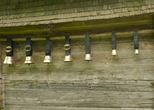 A picture row of Swiss cow bell also known as Treichel hanging at the wall. photo