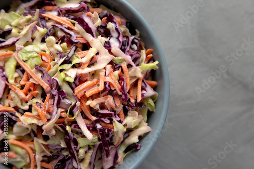 фотографія Homemade Coleslaw with Cabbage and Carrots in a Bowl, top view