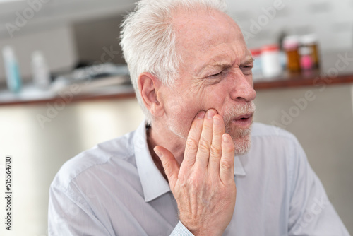Senior man suffering from toothache