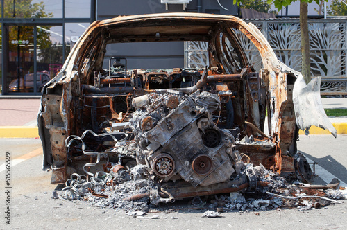 remains of a car destroyed as a result of hostilities in the Kyiv region