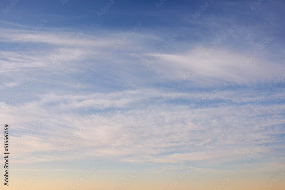 blue sky with high clouds at sunrise. beautiful nature background in morning light. fine weather forecast