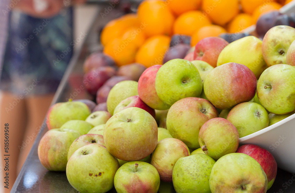 Pile of apples and other fruits on the counter in the market. Pile of apples and other fruits on the counter in the market.