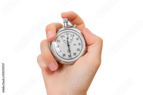 The human hand presses the stopwatch button. Chrome stopwatch in hand.