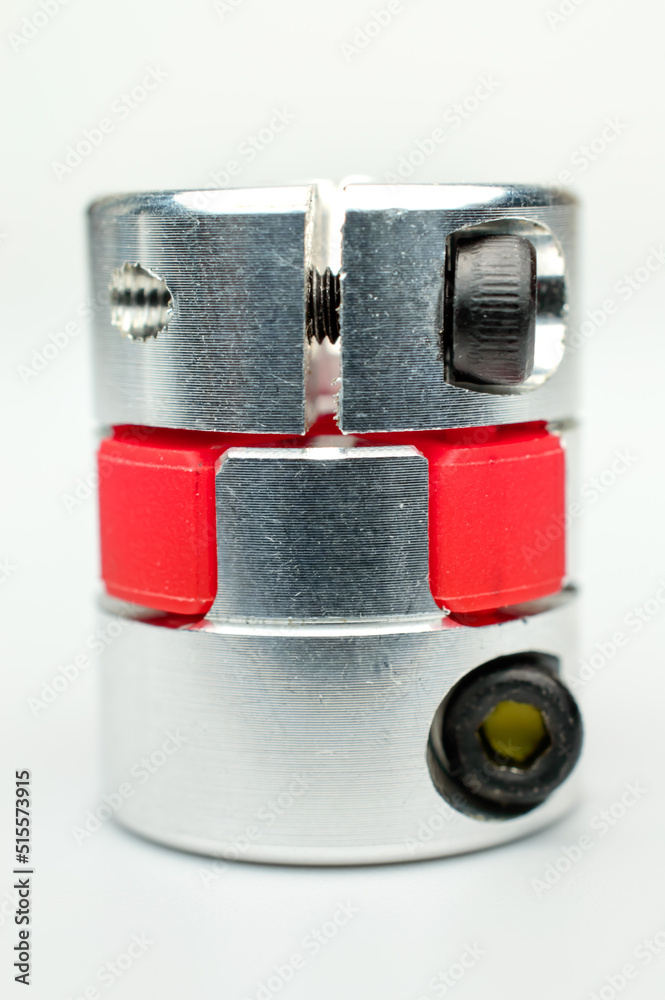 Motor coupling to reduce vibration and smooth start and running of mechanism. Connect to an available spare motor for grinding and polishing work. Selective focus. Background picture.