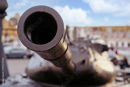 Cannon gun barrel with round hole close-up, traditional fort guard weapon.