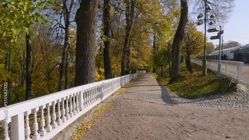 Peterhof in autumn, people are walking in the alleys of the Nizhniy Park. Peterhof in autumn, people are walking in the alleys of the Nizhniy Park.