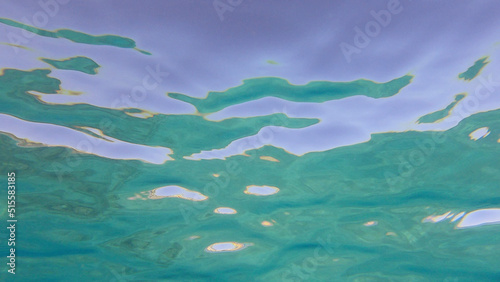 Surface of the sea. Natural background with sun glints on surface of the water. Underwater view. Red sea, Egypt © Andriy Nekrasov