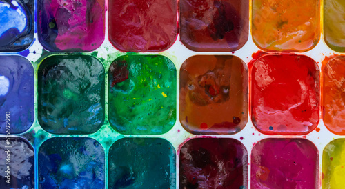 multicolored watercolor paints close-up, paint background