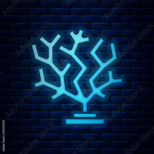 Glowing neon Coral icon isolated on brick wall background. Vector