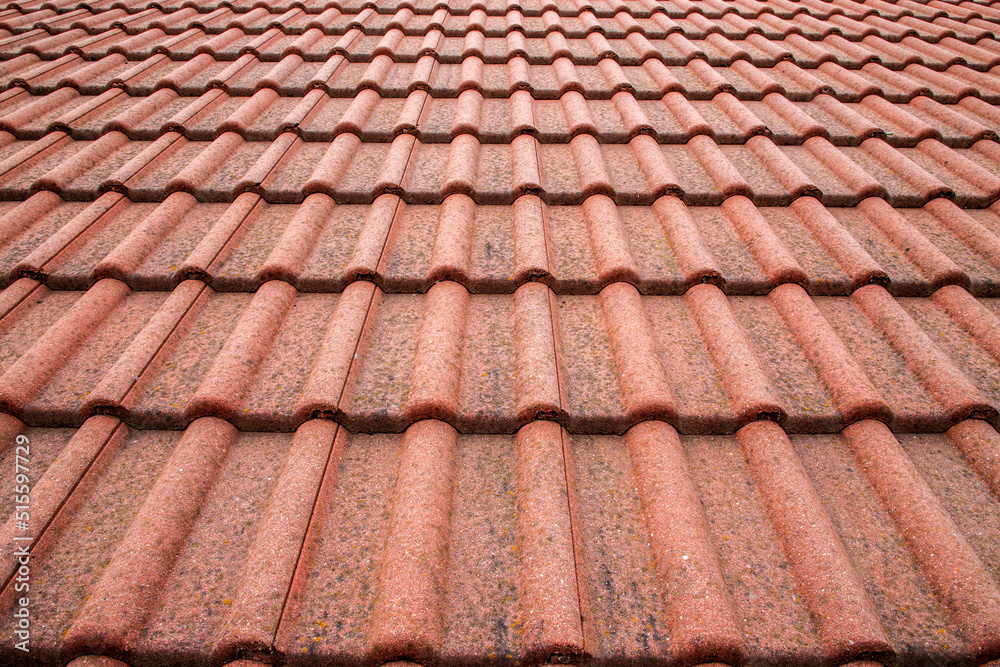 New roof with ceramic tiles close-up. Roofing tiles New roof with ceramic tiles close-up. Roofing tiles