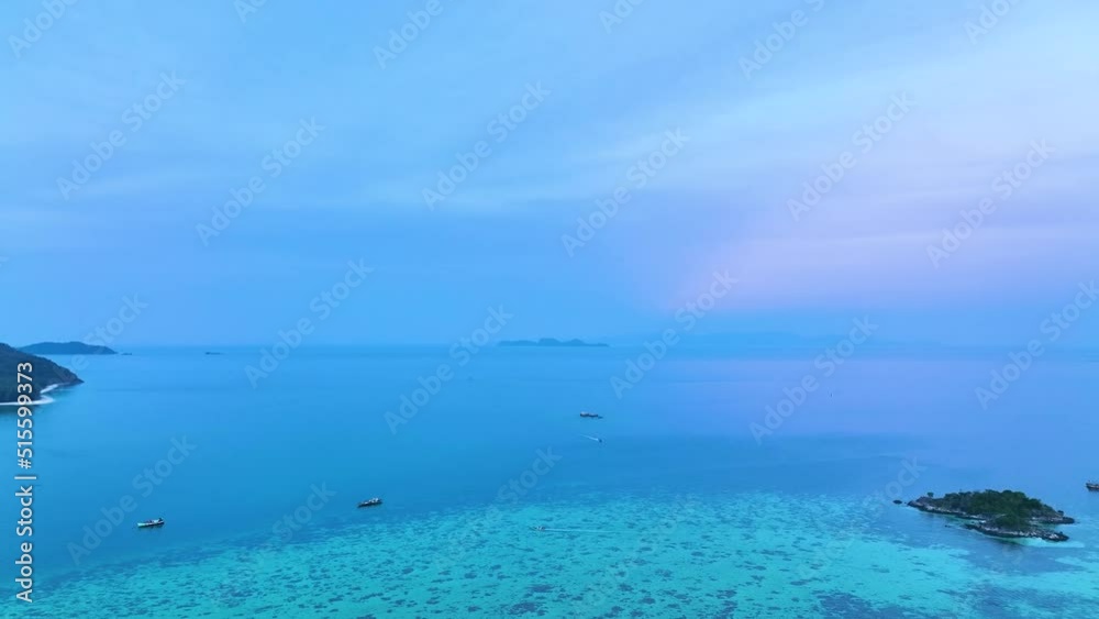 Sunset in a horizon sky over the coastline in the island which orange sky above on the sea, Amazing summer sunrise as a background Sunset in a horizon sky over the coastline in the island which orange sky above on the sea, Amazing summer sunrise as a background