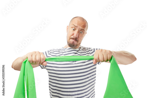 Handsome funny male athlete in stretching band loop with hands preparing for productive workout training isolated on white background 