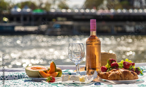 Picnic and wine near the Eiffel Tower. Selective focus. photo