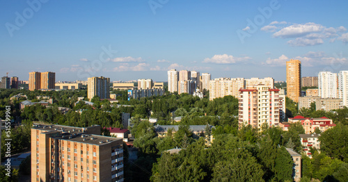 Panoramic top view of the city of Reutov in the Moscow region with modern multi-storey buildings on a clear sunny summer day