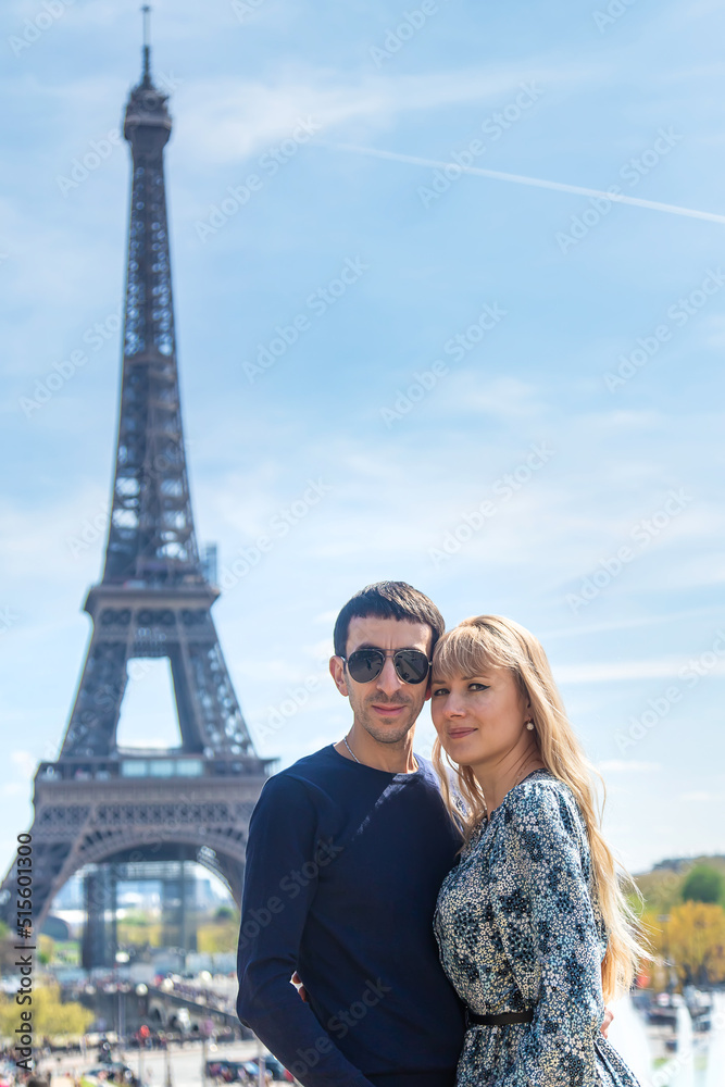 Couple man and woman near the eiffel tower. Selective focus.