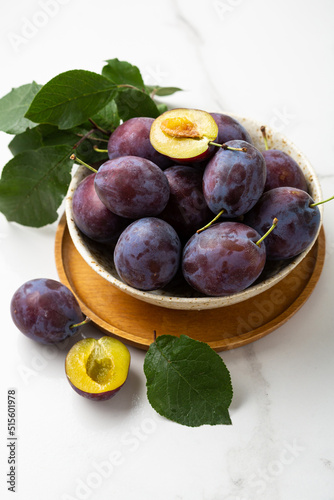 Close up of fresh plums fruits food in bowl