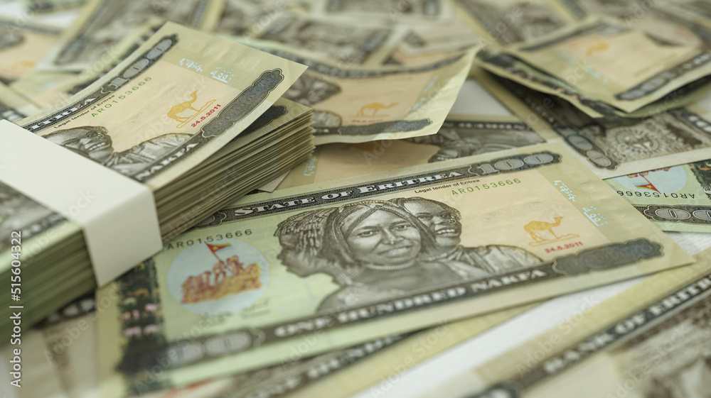 close up of 100 Eritrean nakfa notes spread on table. 3d rendering on money scattered on surface close up of 100 Eritrean nakfa notes spread on table. 3d rendering on money scattered on surface