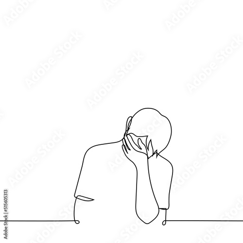 man lowered his head covering his eyes with his hand - one line drawing vector. concept of cringe, hiding tears, migraine, suffering, shame photo