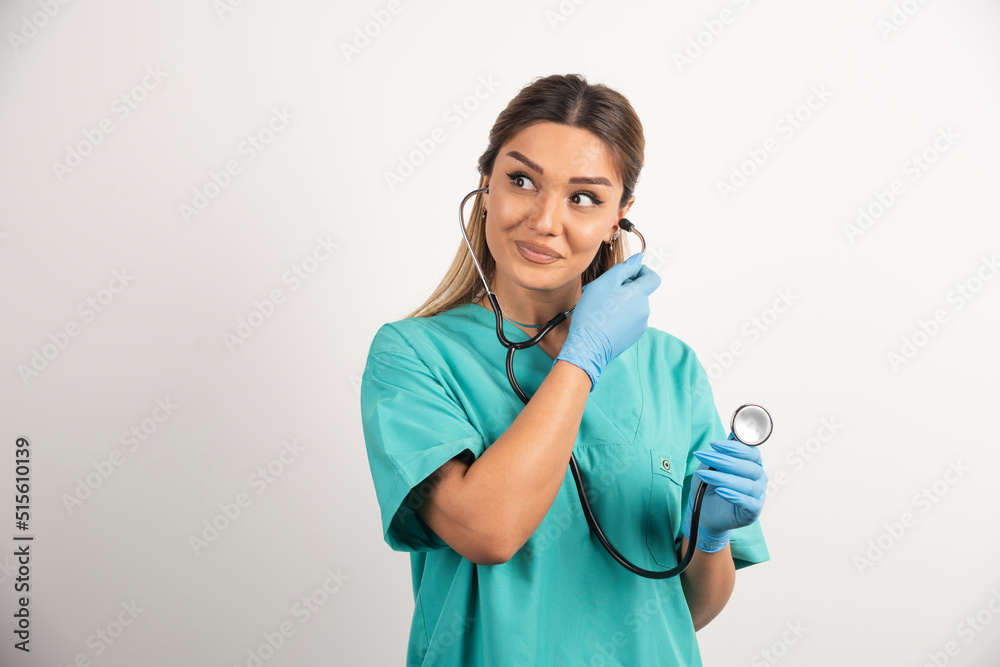 Young smiling female nurse posing with stethoscope Young smiling female nurse posing with stethoscope