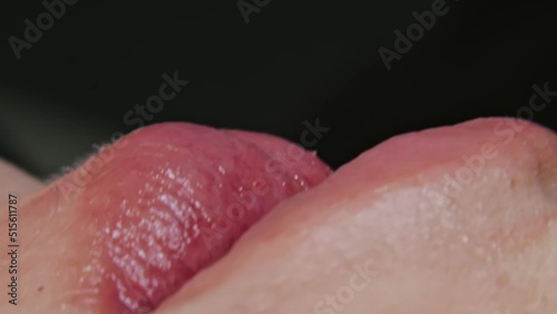 Lips are wiped with a cotton pad.Macro photography.Black background.