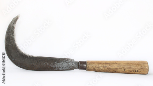 Traditional Sickle with wooden handle in White Background or isolated background.