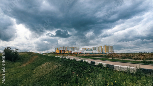 landscape view of the city on a cloudy summer day
