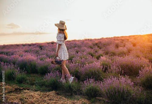 Canvastavla portrait of a young blonde girl in a lavender field in the summer at sunset